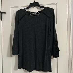 Maurice’s, size medium, good condition, but has been worn, gray w/ black detail